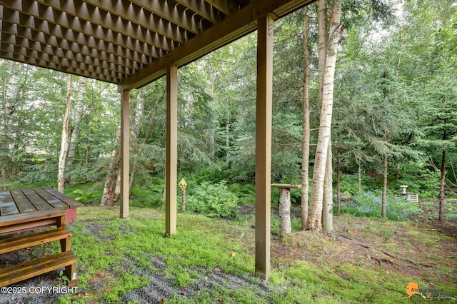 7862 Spruce St Unit 7B, Anchorage, AK 99507 - view of yard featuring a wooded view
