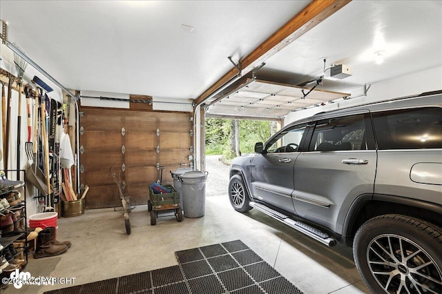 311 Alpine Meadows Ave, Girdwood, AK 99587 - garage featuring a garage door opener