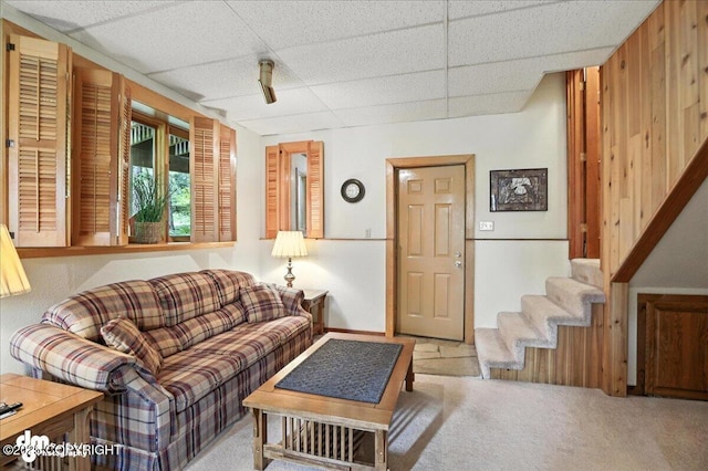 311 Alpine Meadows Ave, Girdwood, AK 99587 - living area with a paneled ceiling, carpet, and stairway