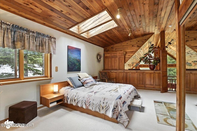 311 Alpine Meadows Ave, Girdwood, AK 99587 - carpeted bedroom featuring lofted ceiling, wood ceiling, wood walls, and a skylight