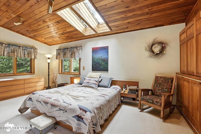 311 Alpine Meadows Ave, Girdwood, AK 99587 - bedroom featuring light colored carpet, vaulted ceiling, a skylight, and wood ceiling
