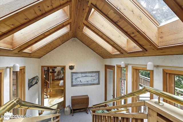311 Alpine Meadows Ave, Girdwood, AK 99587 - hallway featuring a skylight, carpet flooring, lofted ceiling, and wooden ceiling