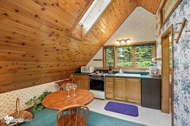 311 Alpine Meadows Ave, Girdwood, AK 99587 - kitchen with white appliances, wallpapered walls, vaulted ceiling, a skylight, and wooden ceiling