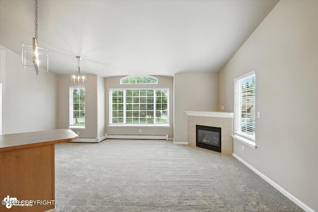 5612 E Beaver Ave, Wasilla, AK 99654 - unfurnished living room with carpet flooring, vaulted ceiling, a tile fireplace, and a baseboard radiator