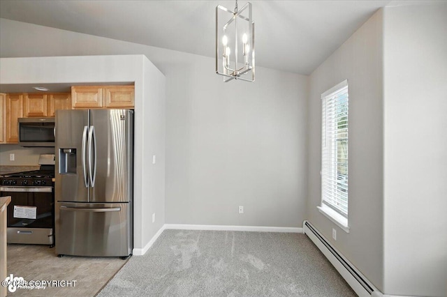 5612 E Beaver Ave, Wasilla, AK 99654 - kitchen with stainless steel appliances, a baseboard radiator, light colored carpet, a chandelier, and decorative light fixtures