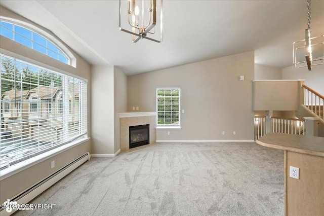 5612 E Beaver Ave, Wasilla, AK 99654 - unfurnished living room featuring a chandelier, a baseboard heating unit, vaulted ceiling, healthy amount of natural light, and carpet flooring