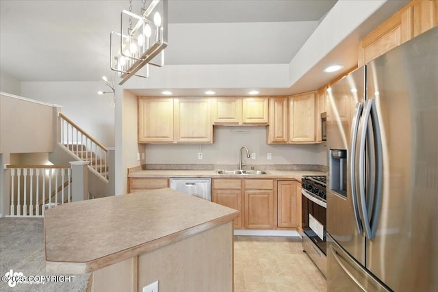 5612 E Beaver Ave, Wasilla, AK 99654 - kitchen featuring appliances with stainless steel finishes, light brown cabinetry, recessed lighting, light countertops, and decorative light fixtures
