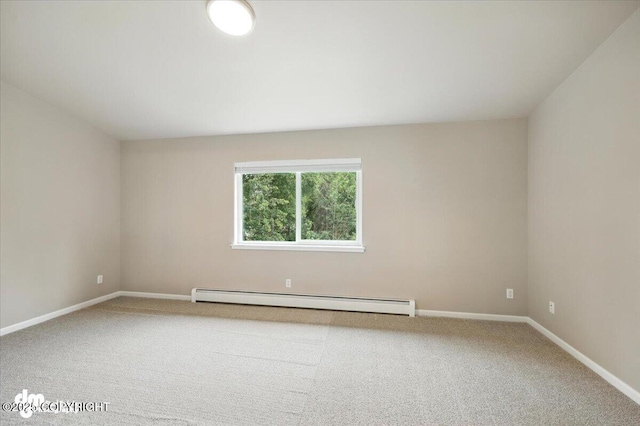 5612 E Beaver Ave, Wasilla, AK 99654 - carpeted spare room with a baseboard radiator and baseboards