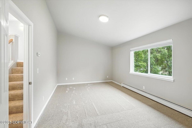 5612 E Beaver Ave, Wasilla, AK 99654 - carpeted spare room featuring baseboard heating and stairs