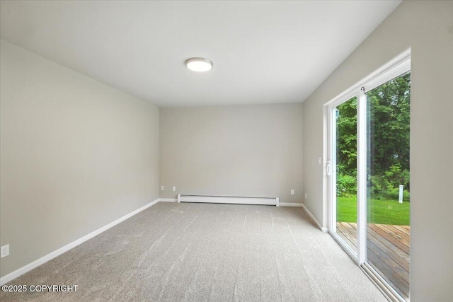 5612 E Beaver Ave, Wasilla, AK 99654 - carpeted empty room with a baseboard heating unit and baseboards