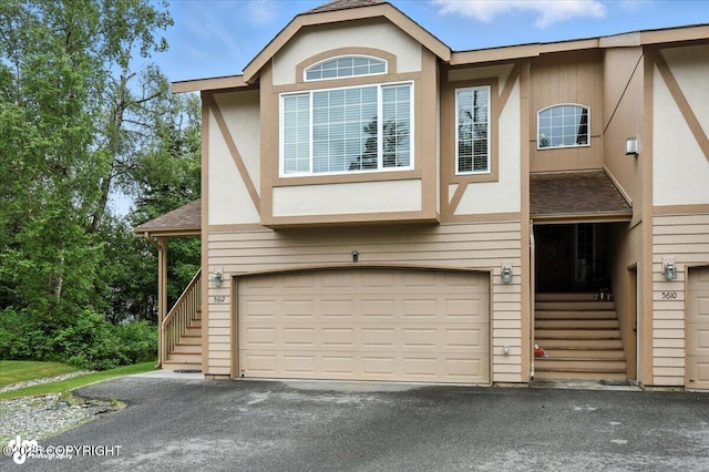 5612 E Beaver Ave, Wasilla, AK 99654 - view of property with a garage, asphalt driveway, and stairs