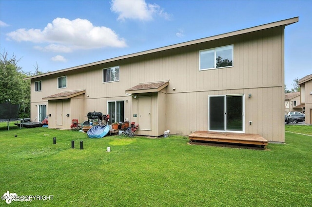 5612 E Beaver Ave, Wasilla, AK 99654 - back of property with a lawn and a trampoline