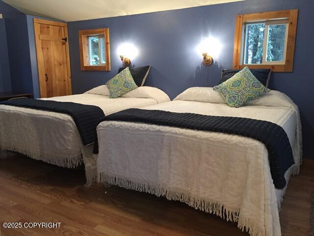 40996 Woodman Ln, Homer, AK 99603 - bedroom featuring wood finished floors and vaulted ceiling