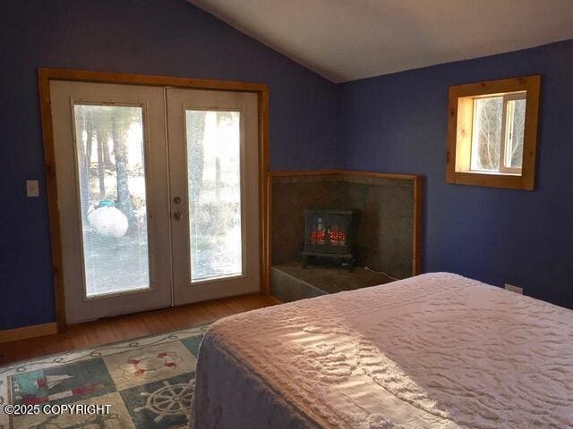 40996 Woodman Ln, Homer, AK 99603 - bedroom with access to exterior, french doors, lofted ceiling, and wood finished floors