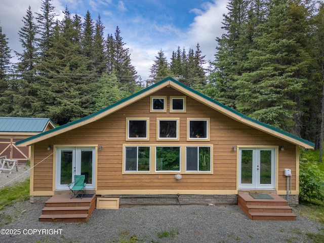 40996 Woodman Ln, Homer, AK 99603 - rear view of house with french doors and a wooden deck