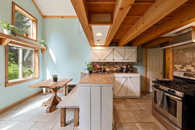 40996 Woodman Ln, Homer, AK 99603 - kitchen featuring gas range, white cabinetry, tasteful backsplash, light tile patterned flooring, and light countertops