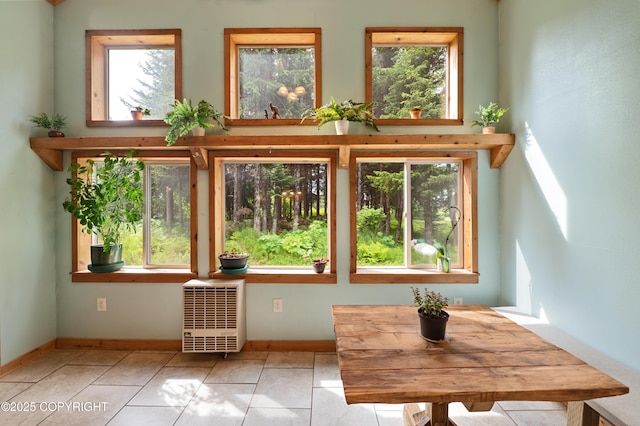 40996 Woodman Ln, Homer, AK 99603 - unfurnished dining area with plenty of natural light and tile patterned flooring