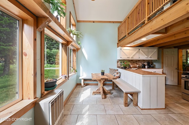 40996 Woodman Ln, Homer, AK 99603 - kitchen with a peninsula, plenty of natural light, and tasteful backsplash