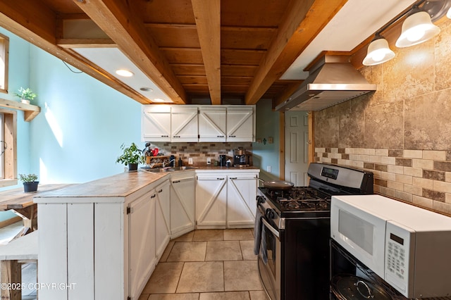 40996 Woodman Ln, Homer, AK 99603 - kitchen with gas range, white microwave, island exhaust hood, a peninsula, and decorative backsplash