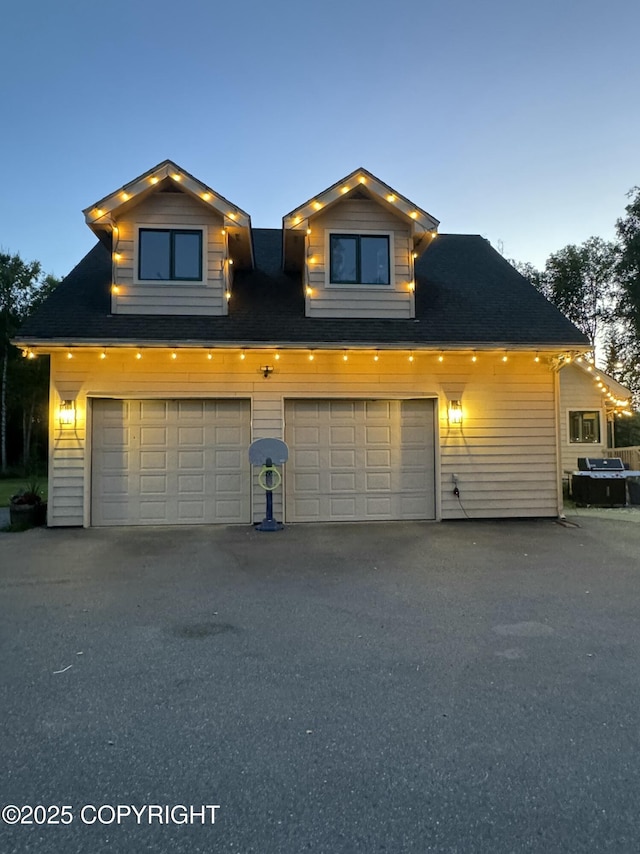 9803 W King Arthur Dr, Wasilla, AK 99623 - view of front of home featuring an attached garage and asphalt driveway