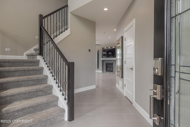 5062 E Calf Cir, Wasilla, AK 99654 - foyer featuring stairs, a glass covered fireplace, and recessed lighting