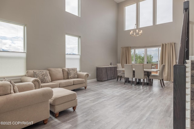 5062 E Calf Cir, Wasilla, AK 99654 - living area with a chandelier, a high ceiling, and wood finished floors