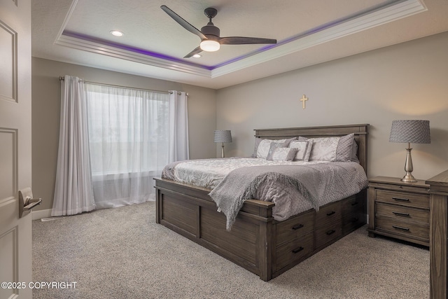 5062 E Calf Cir, Wasilla, AK 99654 - carpeted bedroom with a tray ceiling, ceiling fan, and recessed lighting