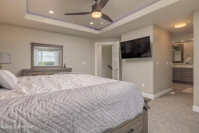 5062 E Calf Cir, Wasilla, AK 99654 - bedroom with a tray ceiling, light carpet, recessed lighting, connected bathroom, and ornamental molding