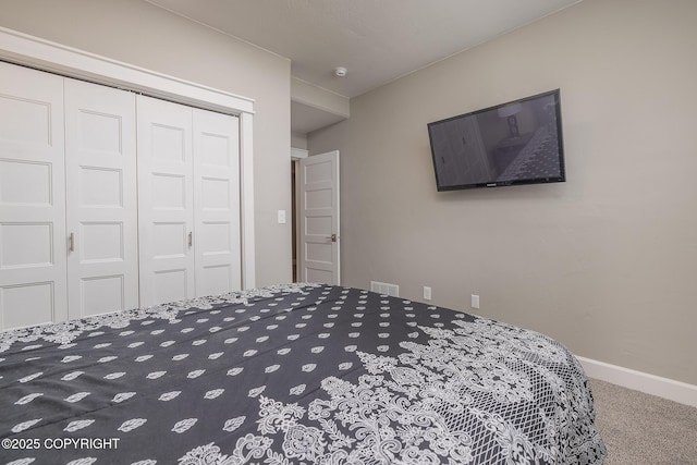5062 E Calf Cir, Wasilla, AK 99654 - carpeted bedroom with a closet and baseboards