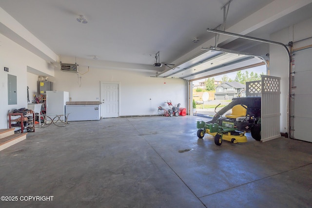 5062 E Calf Cir, Wasilla, AK 99654 - garage with electric panel, a garage door opener, water heater, and a heating unit