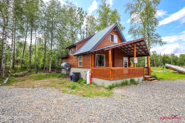 20057 E Caswell Lakes Rd, Willow, AK 99688 - view of front of house with a porch and a metal roof