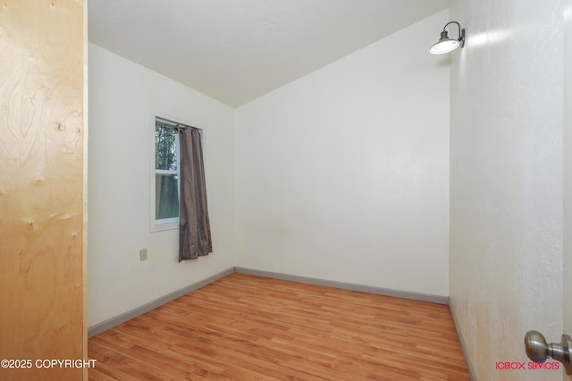 20057 E Caswell Lakes Rd, Willow, AK 99688 - spare room with light wood-type flooring and vaulted ceiling