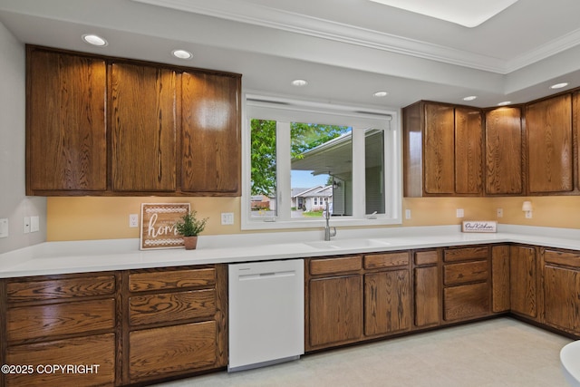 1103 Inlet Woods Dr, Kenai, AK 99611 - kitchen with dishwasher, ornamental molding, recessed lighting, light countertops, and brown cabinets