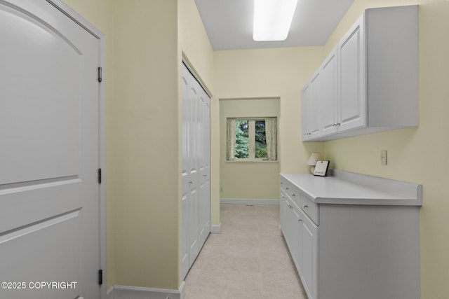 1103 Inlet Woods Dr, Kenai, AK 99611 - laundry area featuring baseboards