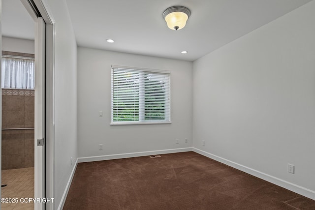 1103 Inlet Woods Dr, Kenai, AK 99611 - empty room featuring dark colored carpet and recessed lighting
