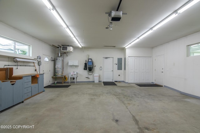 1103 Inlet Woods Dr, Kenai, AK 99611 - garage featuring water heater, electric panel, and a garage door opener