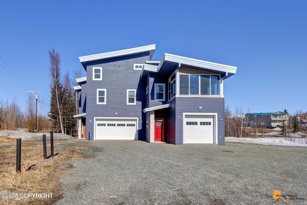 445 Westcove Dr, Wasilla, AK 99654 - view of side of home featuring an attached garage and driveway