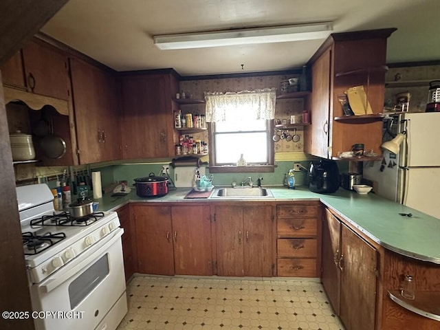 339 Cassiar St, Wrangell, AK 99929 - kitchen featuring white range with gas stovetop, open shelves, and light floors