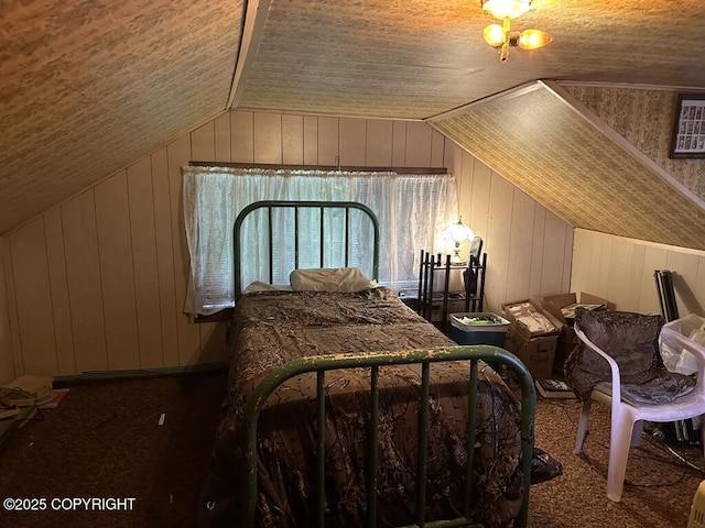 339 Cassiar St, Wrangell, AK 99929 - bedroom with carpet flooring, vaulted ceiling, and wooden walls