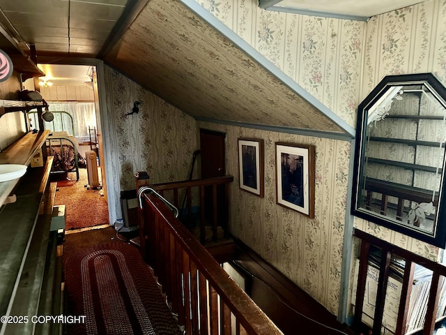 339 Cassiar St, Wrangell, AK 99929 - hallway featuring wallpapered walls, carpet, an upstairs landing, and lofted ceiling