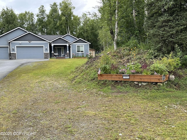 1380 S Countrywood Dr, Wasilla, AK 99623 - view of front of property featuring an attached garage, driveway, and a front lawn