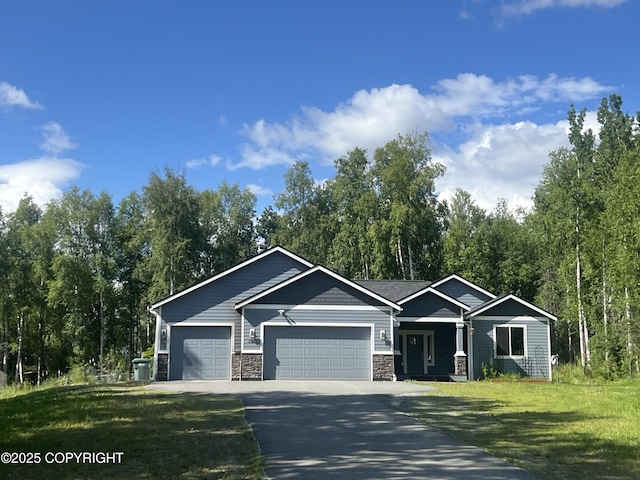 1380 S Countrywood Dr, Wasilla, AK 99623 - view of front facade with a garage, driveway, a front lawn, and stone siding