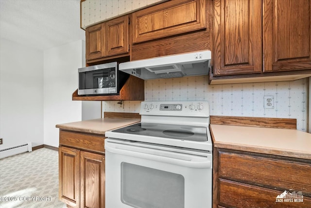 1521 Cache Dr, Anchorage, AK 99507 - kitchen with electric stove, stainless steel microwave, ventilation hood, light floors, and light countertops