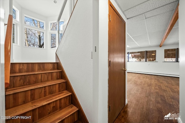1521 Cache Dr, Anchorage, AK 99507 - stairway featuring a baseboard radiator and wood finished floors