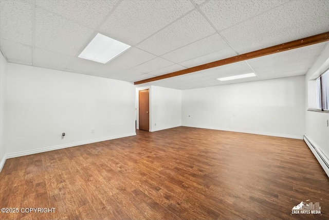 1521 Cache Dr, Anchorage, AK 99507 - empty room featuring wood finished floors, baseboard heating, and a paneled ceiling