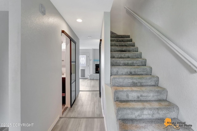 3265 Montclair Ct # 17E, Anchorage, AK 99503 - stairs featuring wood finished floors