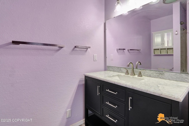3265 Montclair Ct # 17E, Anchorage, AK 99503 - bathroom featuring vanity and a textured wall