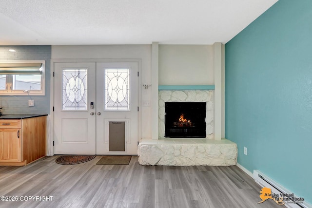 3265 Montclair Ct # 17E, Anchorage, AK 99503 - entryway with light wood-style floors and a stone fireplace