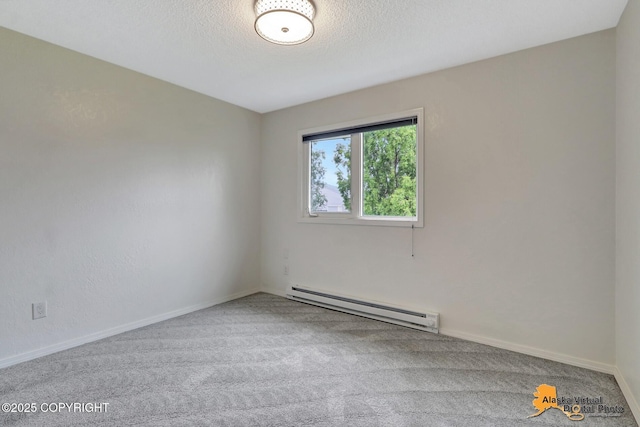 3265 Montclair Ct # 17E, Anchorage, AK 99503 - spare room with a baseboard heating unit, carpet, and a textured ceiling