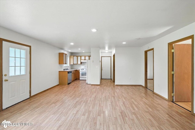 6710 W Joes Dr, Wasilla, AK 99623 - unfurnished living room with light wood-style floors and recessed lighting
